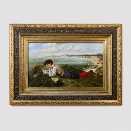 Portrait of Boy Reading on a Bluff